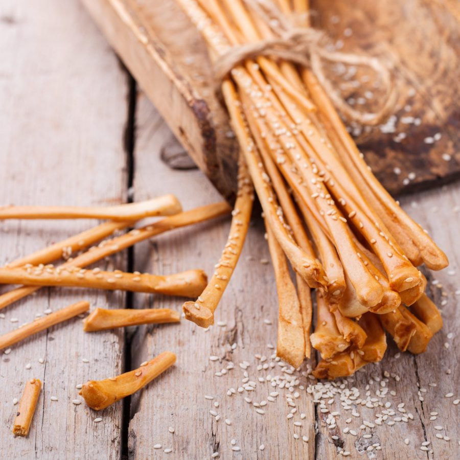 Breadsticks with sesame seeds.Crunchy snack to beer.